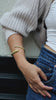 Handcrafted twisted adjustable cuff in 24K gold, brass, or silver. Sustainable jewelry made in Kenya