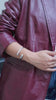 Handcrafted twisted adjustable cuff in 24K gold, brass, or silver. Sustainable jewelry made in Kenya